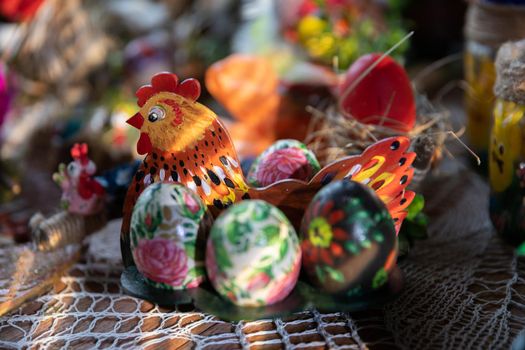 Handmade hen and Easter eggs by an artist as an Easter decoration.