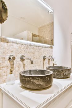 Bathroom with a double marble sink in a modern and cozy house