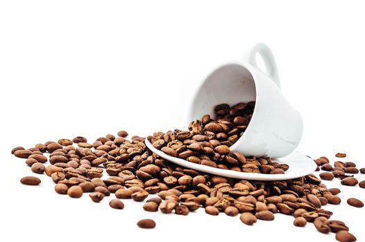 white cup with coffee beans isolated