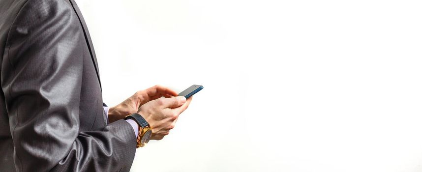 Hands of businessman calling by phone