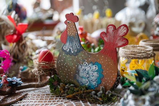 Handmade likeness of a hen sitting on a nest. Artistic handmade decoration for Easter holidays.