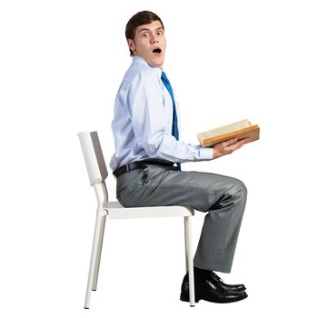 businessman sits on a white chair, with a book, isolated on white background