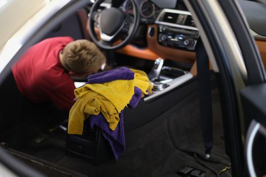 Master does complete dry cleaning of interior of car. Presale car interior cleaning concept