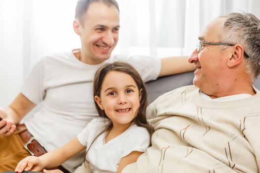 father, son and granddaughter at home