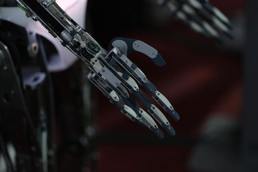 Dark metal robot arm. Creation of technologies and artificial intelligence.