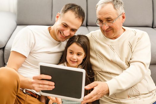 family, generation, technology and people concept - smiling family with tablet pc computers at home