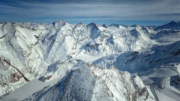 Amazing view from a drone over the snowy mountain hills