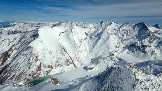 Amazing view from a drone over the snowy mountain hills