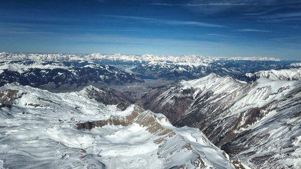 Amazing view from a drone over the snowy mountain hills