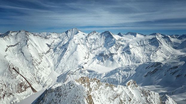 Amazing view from a drone over the snowy mountain hills