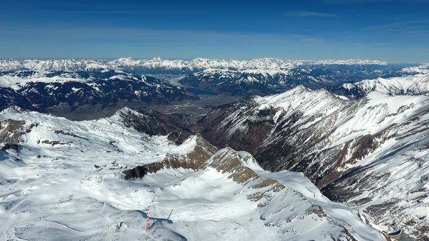 Amazing view from a drone over the snowy mountain hills