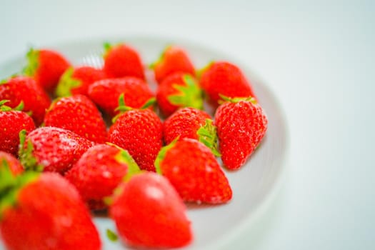 Frozen strawberries and white dishes. Shooting Location: Yokohama-city kanagawa prefecture