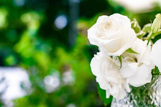 Wedding decoration, table decor and floral beauty, bouquet of white roses in luxury restaurant, beautiful flowers from summer garden.