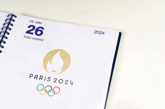 Paris, France, August 2021: An open agenda on the page of July 26, 2024, opening day of the Paris 2024 Summer Olympics. Official Paris 2024 logo. International sporting event.