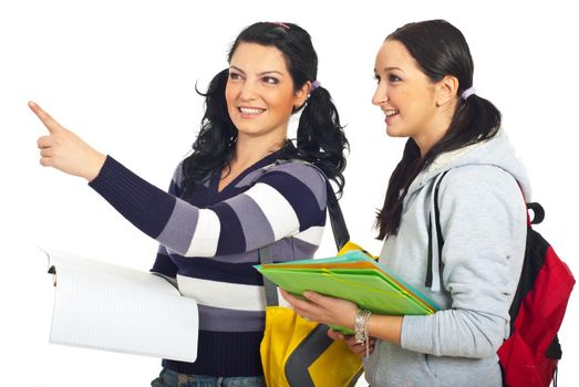 Student woman pointing away and showing something to her colleague isolated on white background