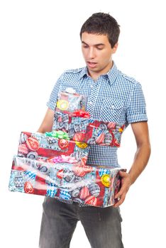 Surprised man holding presents and  trying to keep them to not fall isolated on white background