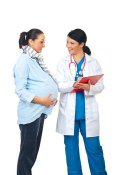 Cheerful pregant and doctor woman having conversation and  the doctor writing in clipboard a prescription isolated on white background