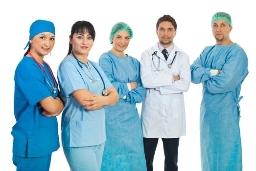 Two healthcare worlers women standing with arms folded in front of image and other team of doctors in background