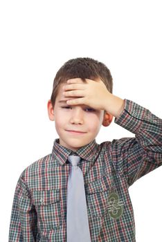 Boy with head ache or being confused holding hand to forehead isolated on white background