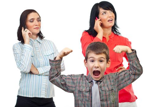 Exasperated child about two women who talk on the phone mobile and do not pay attention to him isolated on white background