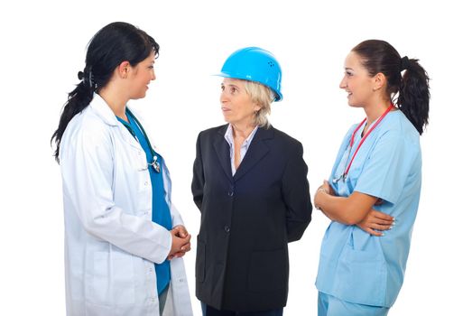 Two doctors women having conversation with architect woman isolated on white background