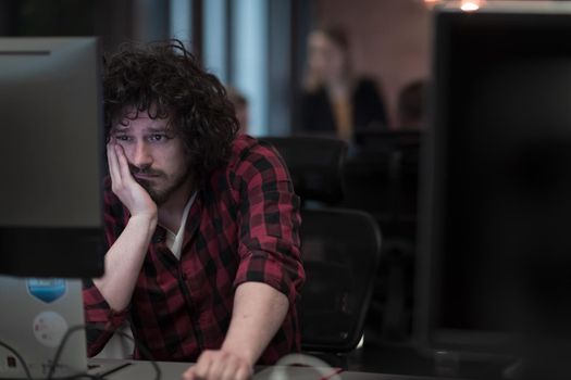 Disappointed businessman wearing headset having virtual team meeting group call chatting with diverse people in customer support. Video conference call on a computer with manager and employees. High-quality photo