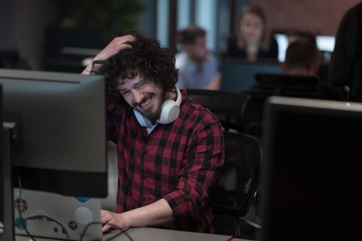 Disappointed businessman wearing headset having virtual team meeting group call chatting with diverse people in customer support. Video conference call on a computer with manager and employees. High-quality photo