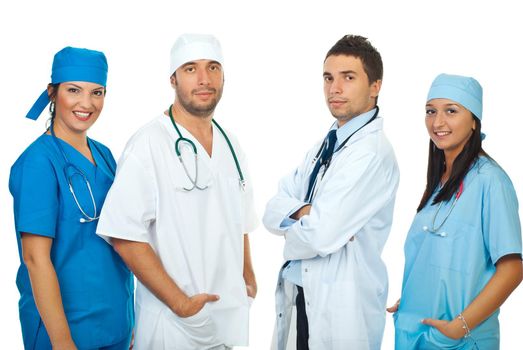 Friendly four different doctors standing in a row isolated on white background