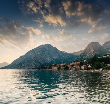 Sunset, beautiful landscape with silhouettes of trees. Travel concept. Montenegro, Kotor Bay. Sunset at Kotor Bay Montenegro. View of the sunset in Boko-Kotor Bay in Montenegro. Silhouettes of mountains. High quality photo