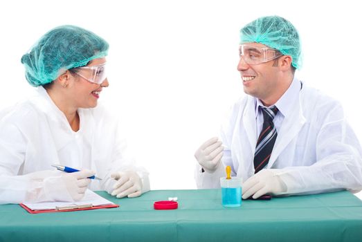 Two laboratory people having conversation and smiling together