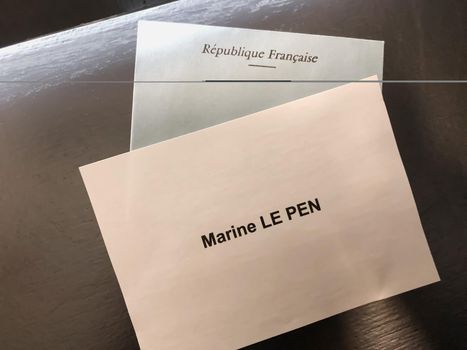PARIS, FRANCE - APRIL 10, 2022: Ballots with the names of candidates for elections in France. Translation Republic of France.Marine Le pen.