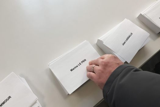 PARIS, FRANCE - APRIL 10, 2022 :Ballots with the names of candidates for elections in France