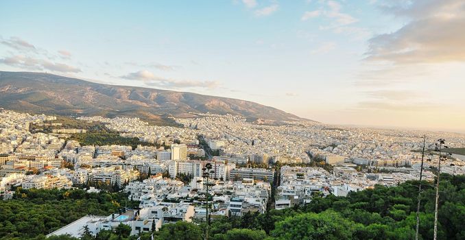 Cityscape of Athens and Lycabettus Hill in the background, Athens, Greece.