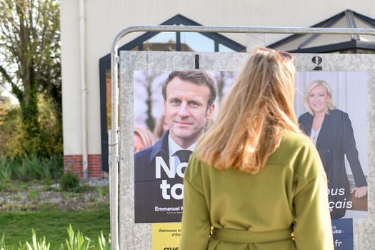 PARIS, FRANCE - APRIL 20, 2022 : The banners with candidates for President elections