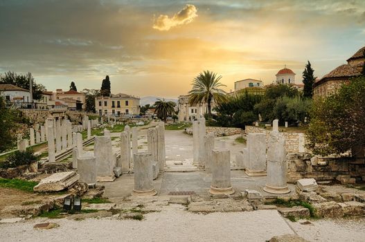 Evening light illuminates ancient ruins inside Roman Agora, Athens, Greece