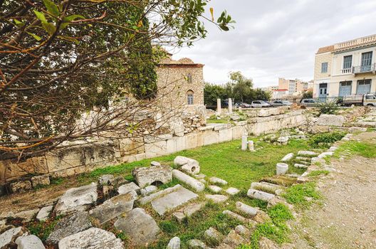 Evening light illuminates ancient ruins inside Roman Agora, Athens, Greece