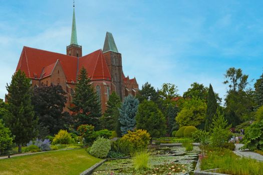 Wroclaw, Poland, August 22, 2021: view of the green park with architecture