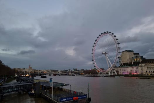 London, United Kingdom, February 8, 2022: Big Ferris wheel on the banks of the River Thames in London
