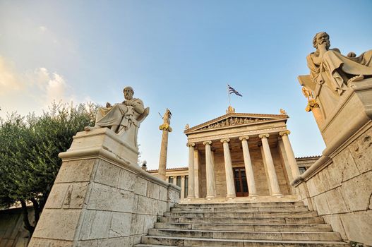 The main entrance of the Academy of Athens, Greece, an emblematic building in the city, and part of the famous architectonic trilogy, known as The Hansen Trilogy. At the left is the statue of Socrates