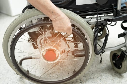 Asian senior or elderly old lady woman patient on electric wheelchair with remote control at nursing hospital ward, healthy strong medical concept