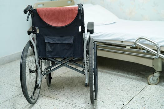 Wheelchair and bed equipment for patient in hospital ward or clinic.