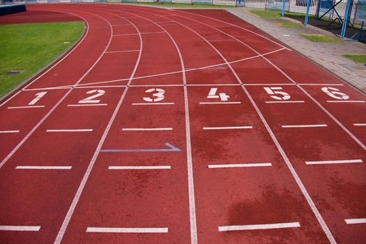 Red running racetrack on the stadium