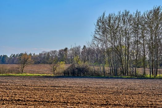 the preparation of land for growing crops.