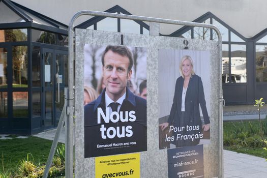 PARIS, FRANCE - APRIL 20, 2022 : The banners with candidates for President elections
