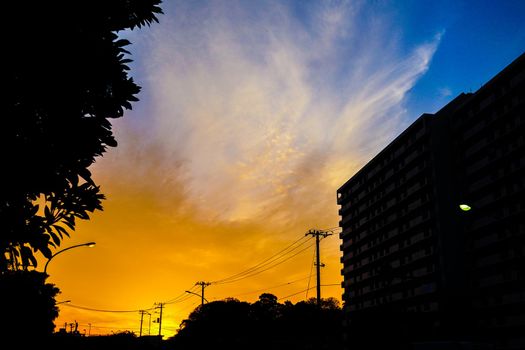 Silhouette of sunset and electric wire and building. Shooting Location: Yokohama-city kanagawa prefecture