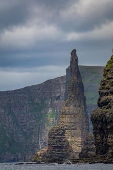 Needle cliffs in the steep coastline of Faroe Islands