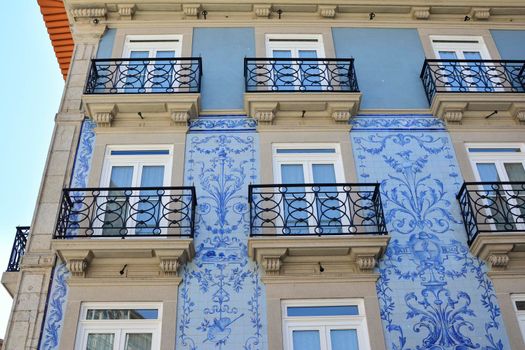 Historic facade in Porto decorated with blue hand painted tin-glazed tiles azulejo Porto, Portugal