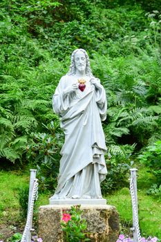 Statue of Jesus with a red heart