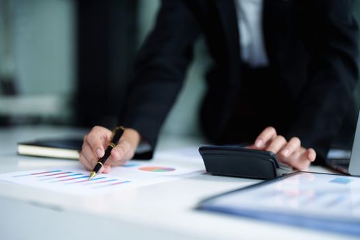 data analysis, plan, marketing, accounting, audit, asian business woman holding pen of planning marketing using statistical data sheet and calculator to present marketing plan project at meeting