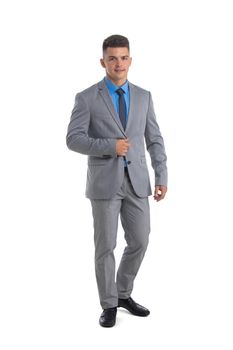 Full body portrait of young business man in gray suit isolated on white background